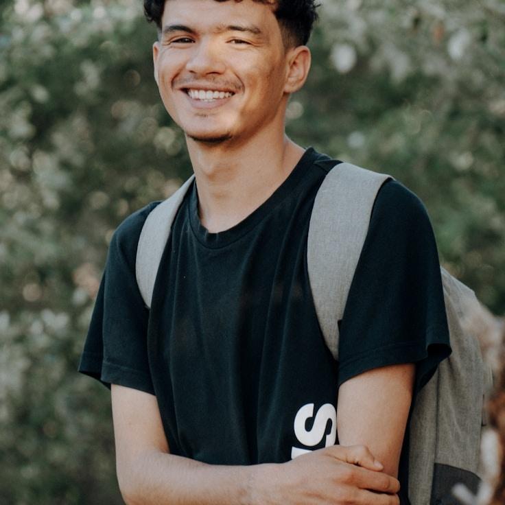 Kaveri Mehta, Lead Design Curator at Vivid Mind Center, reviewing corporate floral arrangements